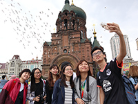 Selfie with Saint Sophia Cathedral and a flock of pigeons (Photo Credit: Miss Christine Mak; Programme Host: Harbin Institute of Technology)
